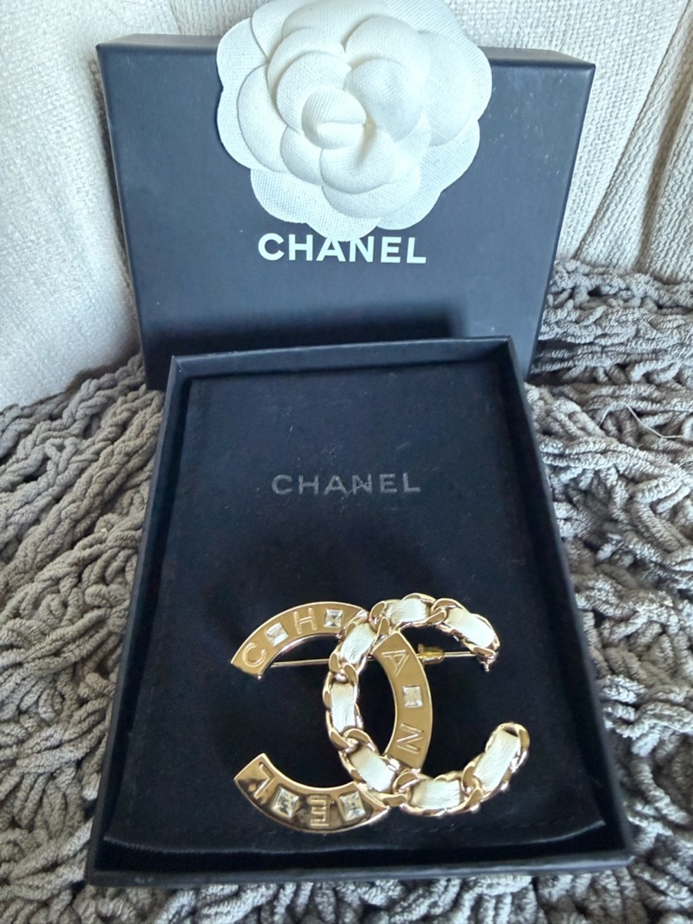 CHANEL Gold Interlocking CC Brooch with Chain Detail